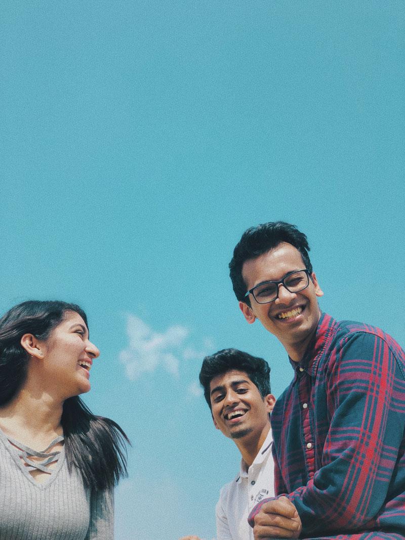 3 friends laughing and smiling