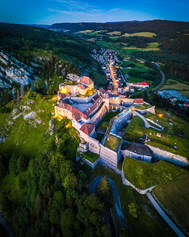 drone view over the chateau de joux jura france