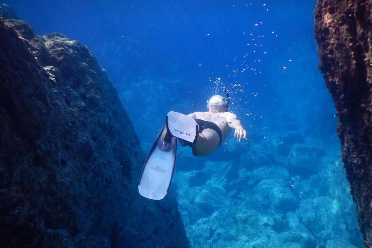 man snorkeling in sardinia