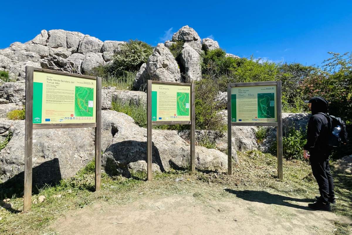 kevin at the hike starting point reading the signs