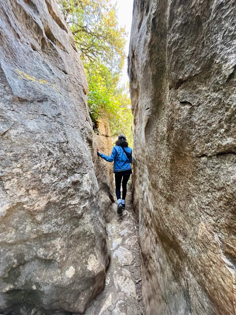 nes walking in between the rocks