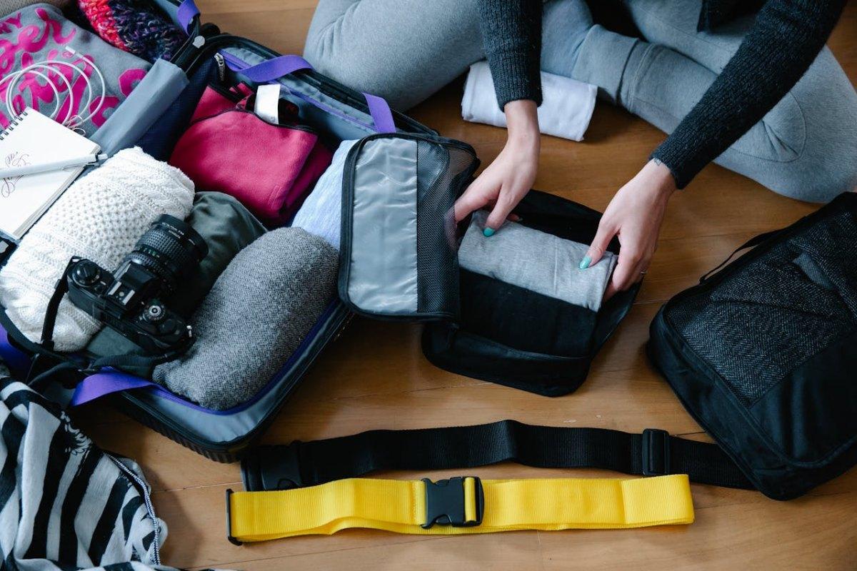 woman packing for europe in autumn