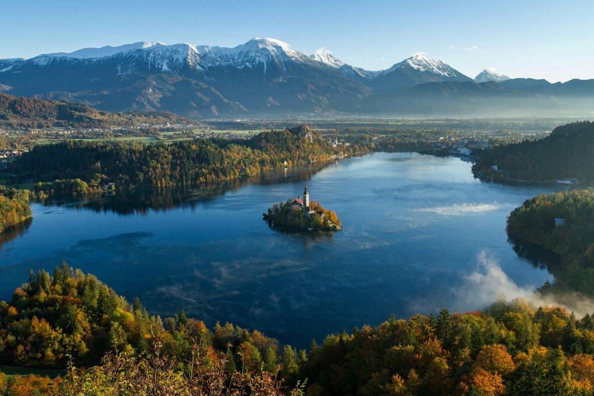 lake bled is one of the most beautiful places to enjoy fall colors in europe